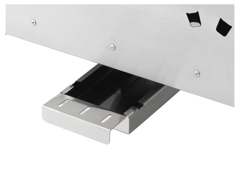 Nahaufnahme einer Stahlgrillplatte mit einer herausziehbaren Fettauffangschale.