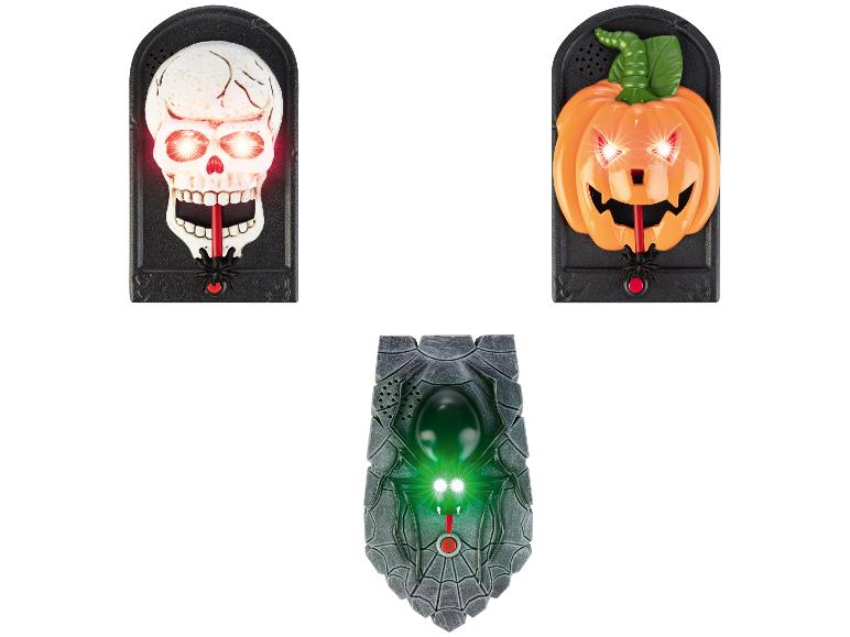 Leuchtende Halloween-Dekorationen: Totenkopf, Kürbis und Spinne.