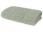 Gefaltetes hellgrünes Handtuch mit gerippten Details.