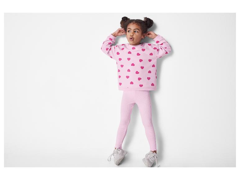 Rosa Herz-Sweatshirt und Leggings für Kinder.