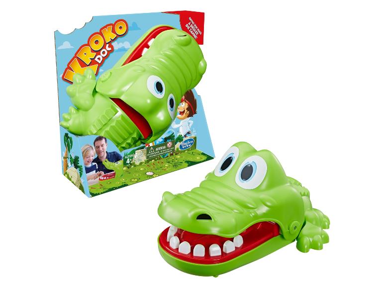 Hasbro Brettspiel 'Krokodil' mit einem grünen Krokodil mit aufklappbarem Maul.
