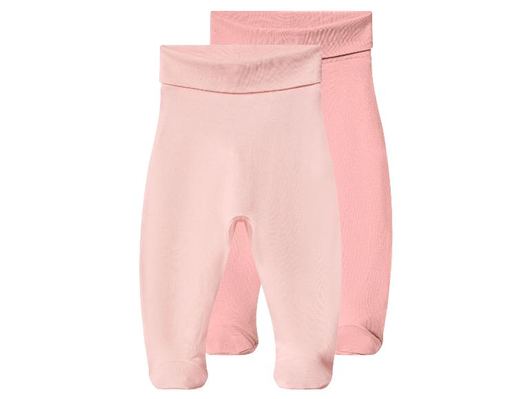 Zwei rosa Babyhosen mit integrierten Füßen und umklappbarem Bund.