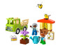 Lego Duplo Spielzeug mit einem grünen LKW, Bienenstock und Figuren.
