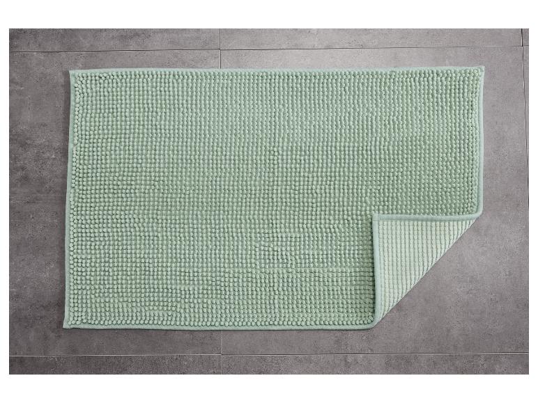 Hellgrüne, strukturierte Badematte.