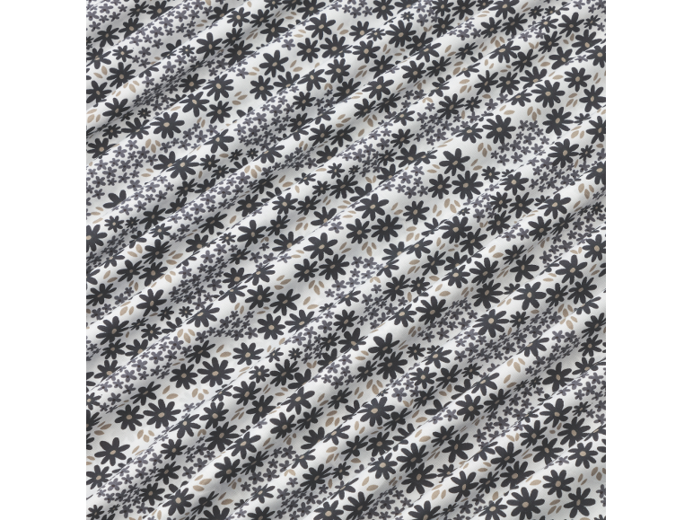 Weißer Stoff mit einem schwarzen Blumenmuster.