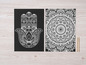 Zwei schwarze Karten mit einem Hamsa- und einem Mandala-Design, bereit zum Ausmalen mit Bleistiften.