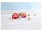 Ein Peppa Pig Spielzeuglastwagen mit Bausteinen und Figuren auf einem weißen Boden.