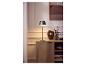 LIVARNO home LED-Akku-Tischleuchte auf einer Holzkommode.