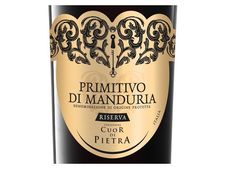 Rotweinetikett mit goldenen Verzierungen und dem Text „Primitivo di Manduria Riserva“.