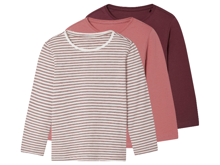 Drei Langarmshirts für Mädchen: gestreift und zwei unifarben.