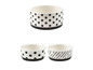 Drei weiße Schalen mit schwarz-weißen Punkten und Streifen.