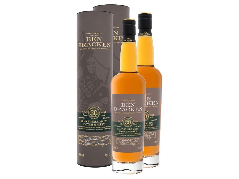 Zwei Flaschen 30 Jahre alter Islay Single Malt Scotch Whisky mit zwei zylindrischen Geschenkboxen.
