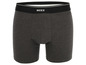 Ein grauer Unterhosen mit einem schwarzen Bund und dem Mexx-Logo.
