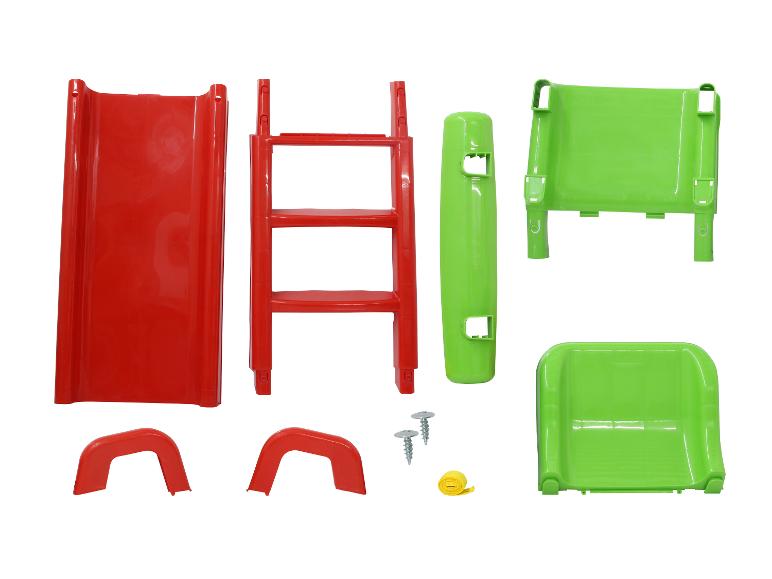 Teile einer roten und grünen Plastikrutsche für Kinder.