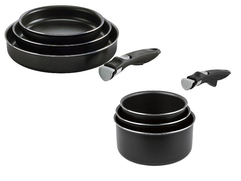 Set aus schwarzen, stapelbaren Pfannen und Töpfen mit abnehmbaren Griffen.