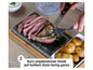 Ein Steak, das auf einem heißen Stein gebraten wird, serviert mit Kartoffeln.