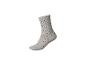 Gepunktete Socken in Beige mit grünen Punkten.