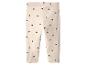 Beige Kinderleggings mit schwarzen Herzen