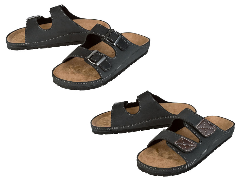 Zwei Paar schwarze Sandalen mit Schnallen.