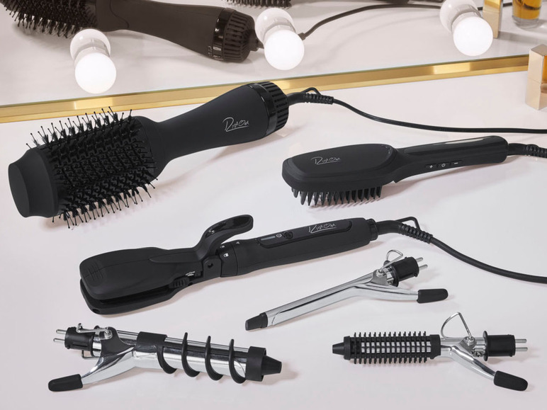 Ein Set mit verschiedenen Styling-Tools der Marke Diva, darunter ein Föhn mit Bürste, ein Glätteisen und ein Lockenstab.
