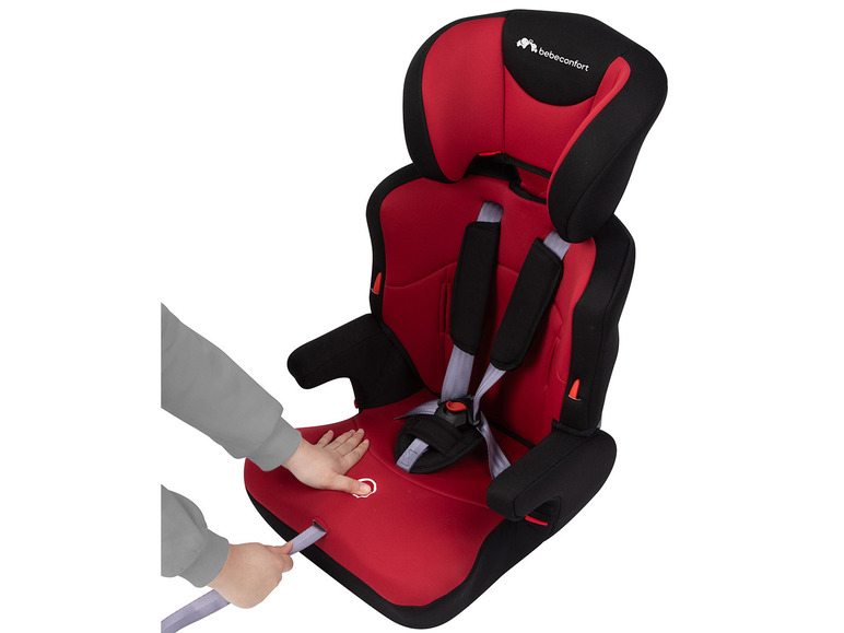 Ein roter Bébé Confort Autositz mit einem grauen Gurt.