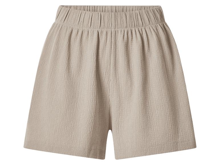 Beige Shorts mit elastischem Bund und gekreppter Textur.