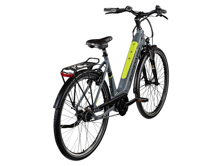 Graues und grünes Zündapp E-Bike mit Gepäckträger und Lichtern.
