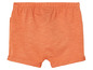 Orangefarbene kurze Hose für Babys.