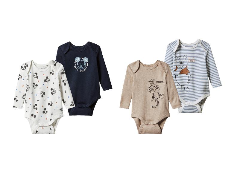 Vier langärmelige Baby-Bodys mit Disney Micky Maus und Winnie Puuh-Prints.