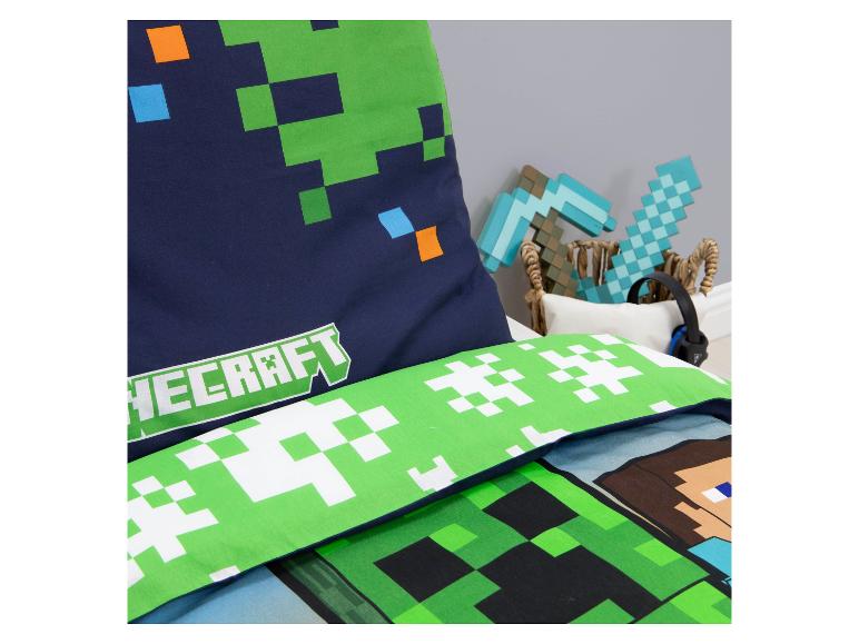 Videospiel-Bettwäsche-Set und Kissen mit Minecraft-Logo.