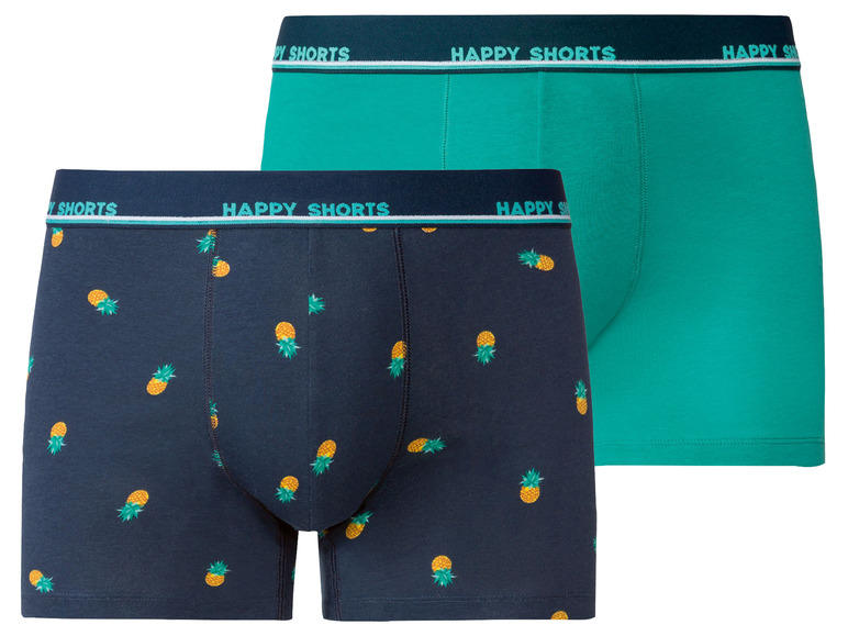 Zwei Paar Happy Shorts Boxershorts, eine mit Ananas-Muster und eine einfarbig türkis.