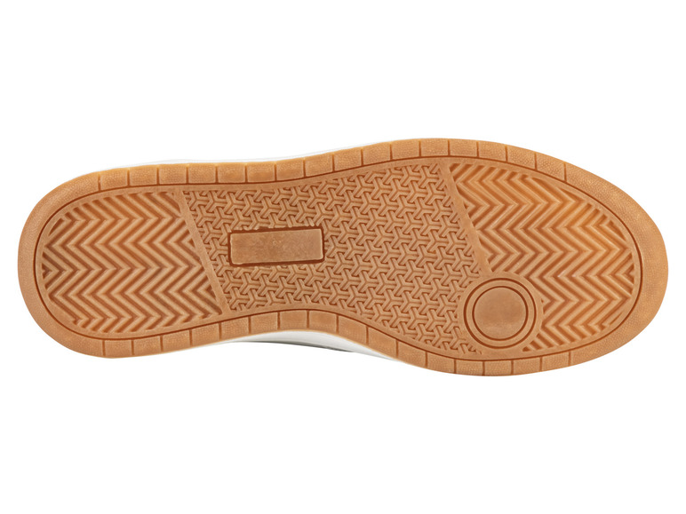 Die Unterseite eines weißen Sneakers mit einer braunen Sohle.