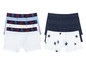 Drei Packungen Boxershorts für Jungen, eine mit Sternen und zwei mit Monstern.