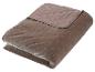 Gefaltete braune gesteppte Samtdecke
