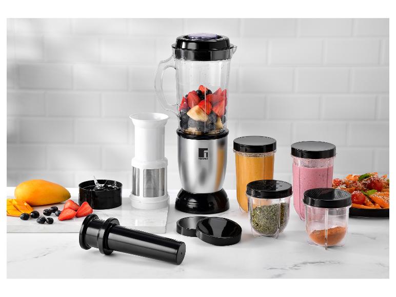 Ein Bergner Mixer mit Früchten, Smoothies und Zubehör auf einem Marmortisch.