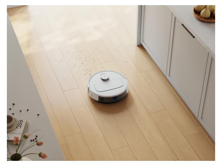 Ein Deebot Saugroboter auf einem Holzboden.