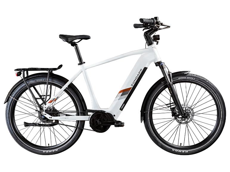 Weißes E-Bike mit Gepäckträger und Kenda-Reifen