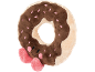 Plüschtier in Donut-Form mit brauner Glasur und rosa Schleife.
