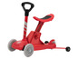 Ein roter Playtive Roller mit Sitz und Lenker.