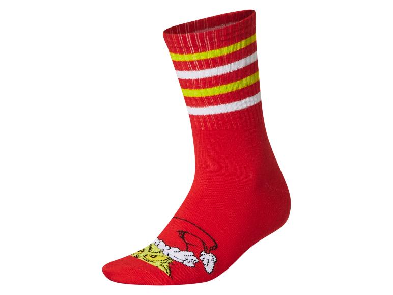 Rote Socke mit gelben und weißen Streifen, mit einer Zeichentrickfigur an der Spitze