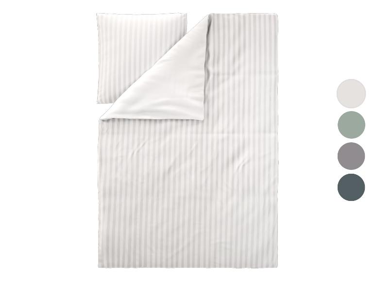 Gestreifte Bettwäschegarnitur mit Kissenbezug und Farbmustern.