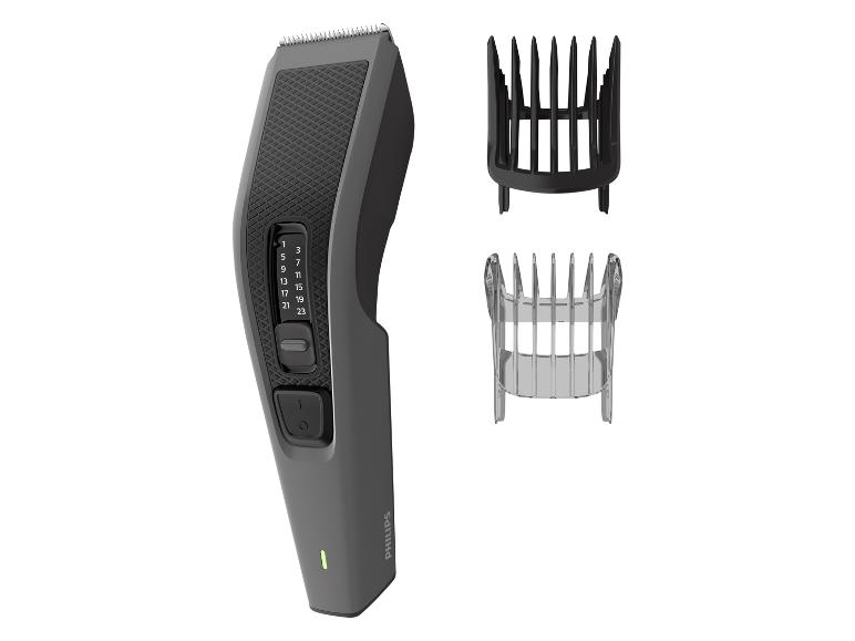 Haarschneider mit einstellbarer Länge und zwei Kammaufsätzen.