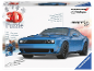 3D-Puzzle eines blauen Sportwagens in einer Schachtel.