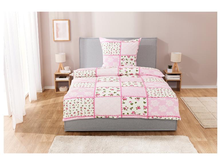 Rosa Bettwäsche mit Patchworkmuster, Blumen und Spitze.