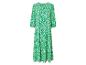 Ein grünes Maxikleid mit weißem geometrischem Muster.