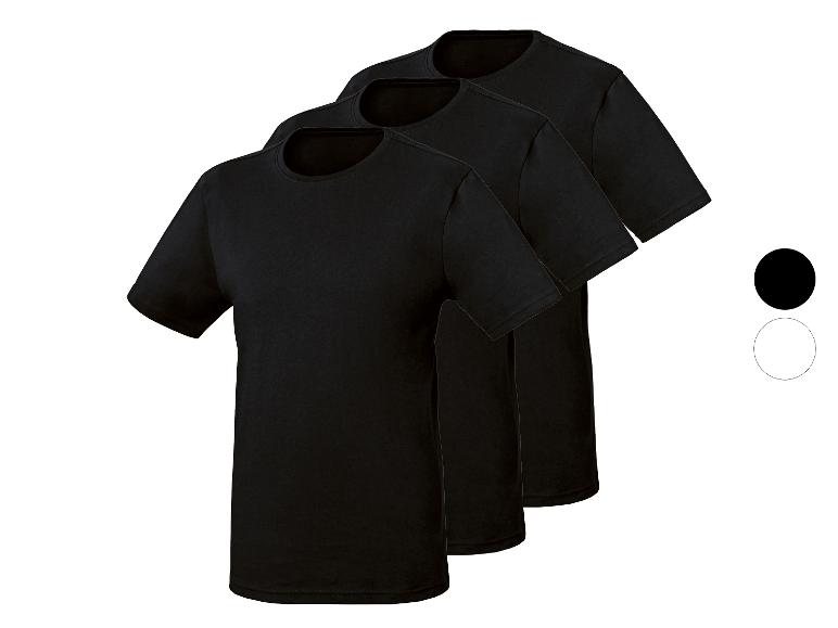 Drei schwarze Rundhals-T-Shirts, diagonal angeordnet