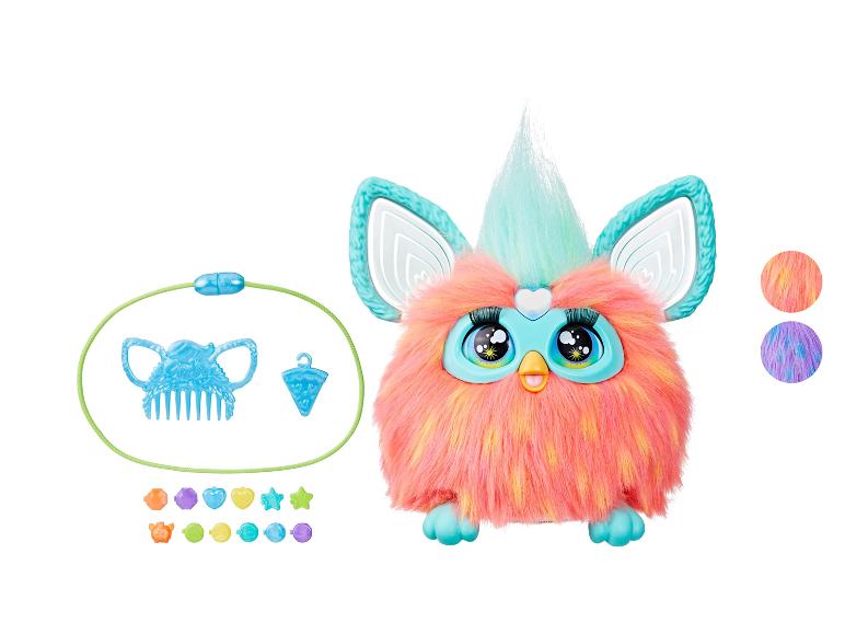 Rosa und blaues interaktives Furby-Spielzeug mit Kamm und Perlen.