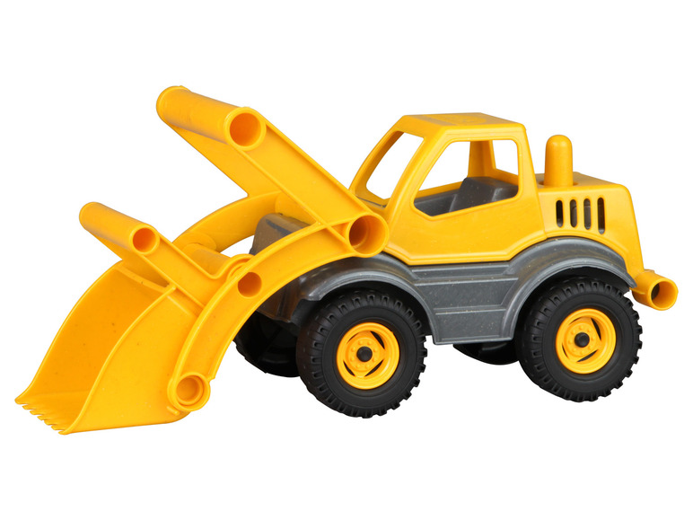 Ein gelber Spielzeugtraktor mit Schaufel.