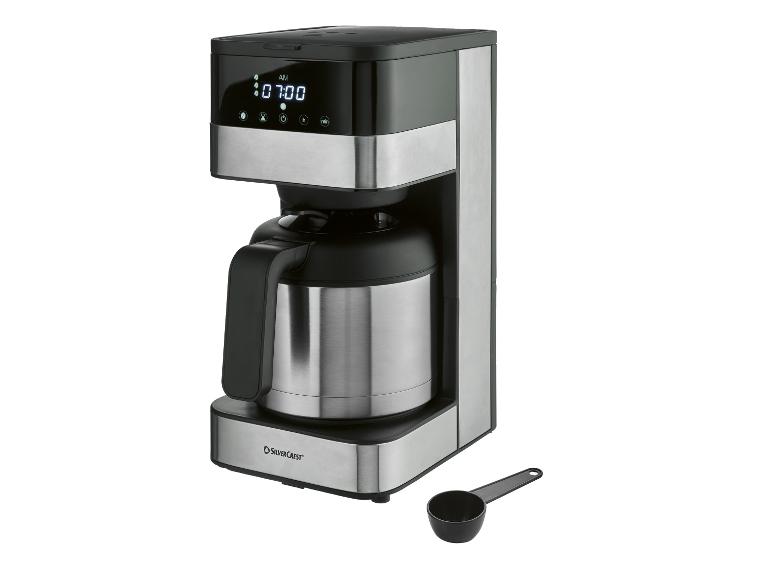Schwarz-silberne Filterkaffeemaschine mit Thermoskanne und digitaler Anzeige, die 07:00 Uhr anzeigt.