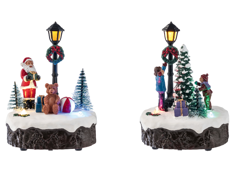 LIVARNO home LED-Weihnachtsdorf-Figuren mit beleuchteten Straßenlaternen und festlichen Szenen.